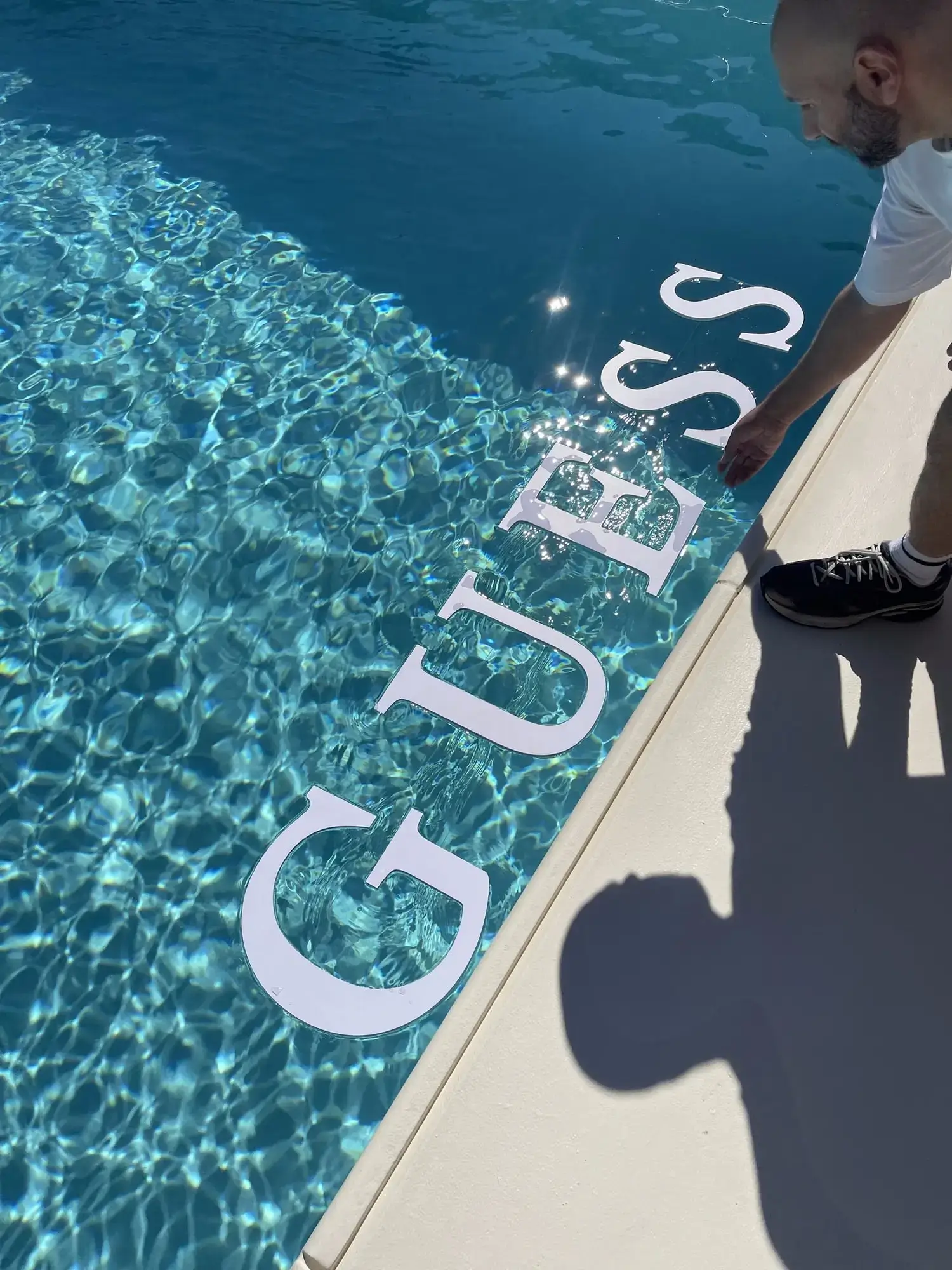 GUESS-branded pool setup at the hotel for the Mykonos influencer activation