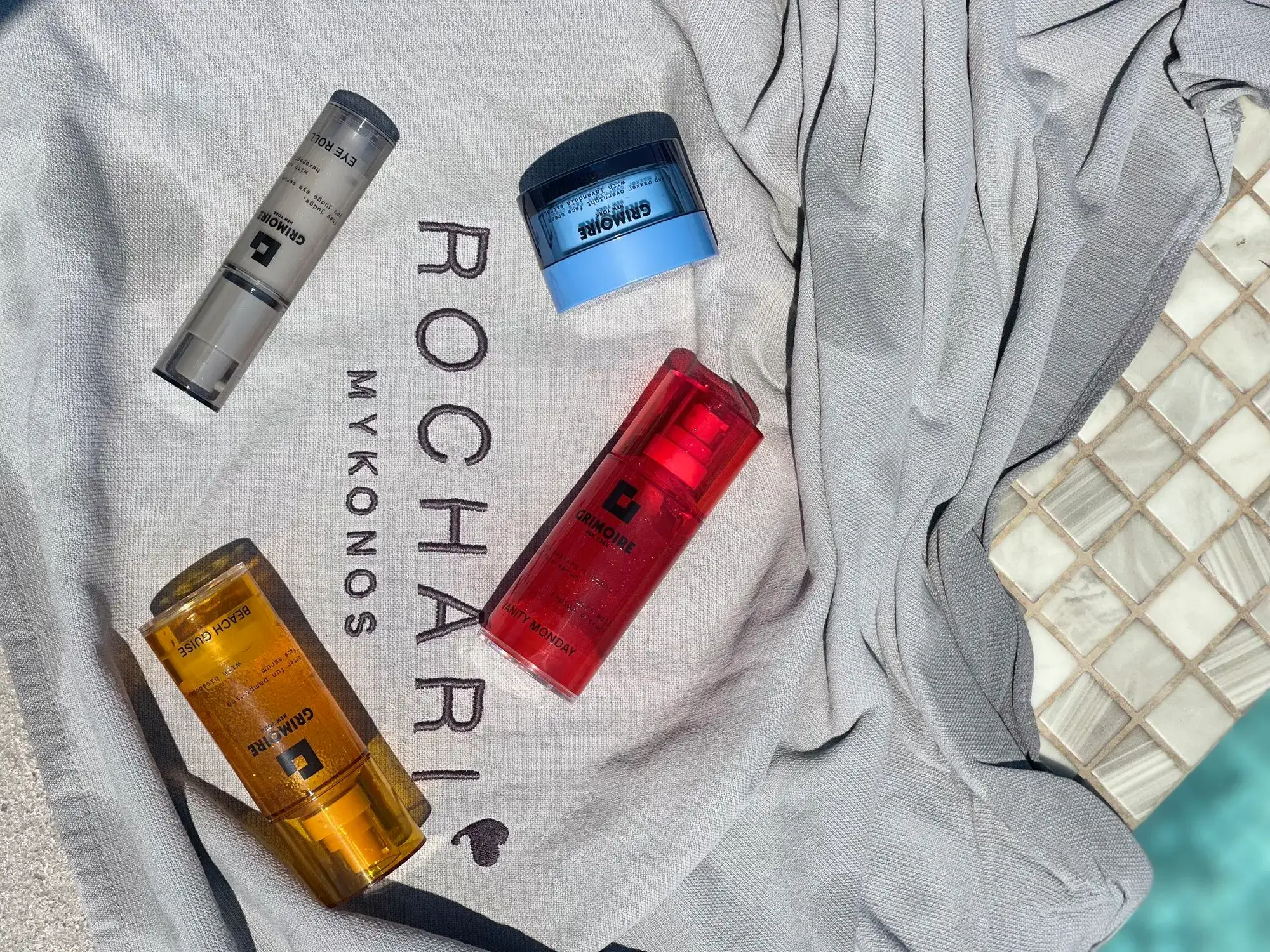Grimoire NYC full product range on Rochari Hotel towel, the partnership collaboration in Mykonos