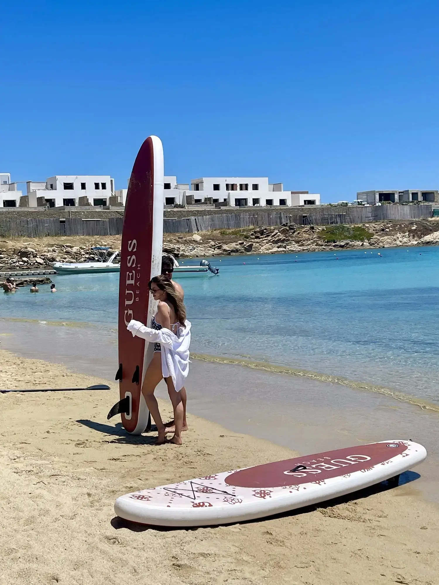 Influencers with GUESS-branded paddleboards at Kalua Beach Mykonos