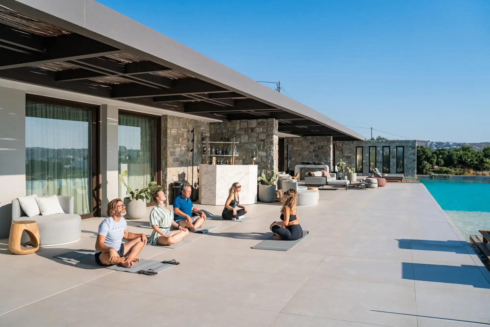 Morning wellness sessions on the villa terrace, overlooking the Aegean